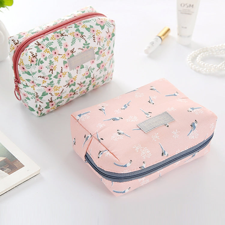 Travel Cosmetic Bag Portable Cosmetic Storage Bag by The Daily Drop with floral patterns and cube shape.