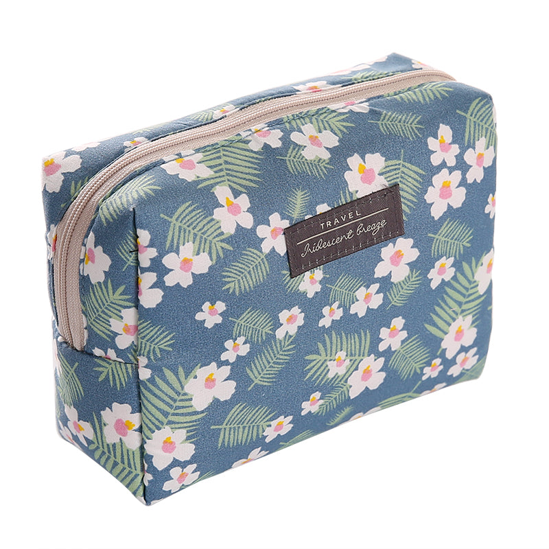 Travel Cosmetic Bag Portable Cosmetic Storage Bag by The Daily Drop with floral pattern and zip closure.