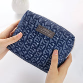 Travel Cosmetic Bag Portable Cosmetic Storage Bag featuring a navy blue zigzag pattern, The Daily Drop.