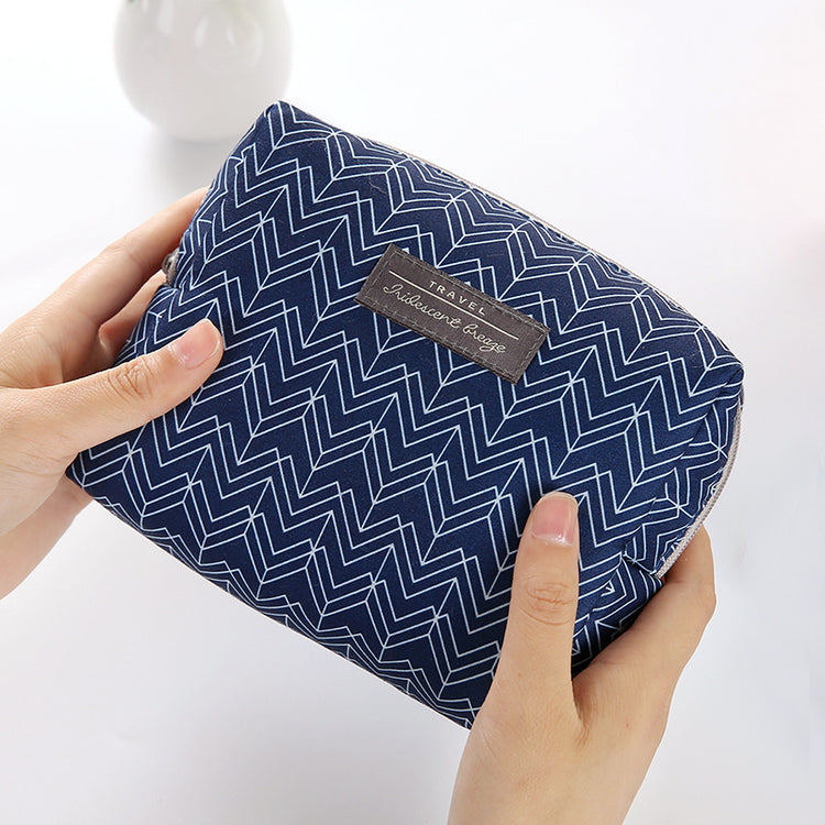 Travel Cosmetic Bag Portable Cosmetic Storage Bag featuring a navy blue zigzag pattern, The Daily Drop.