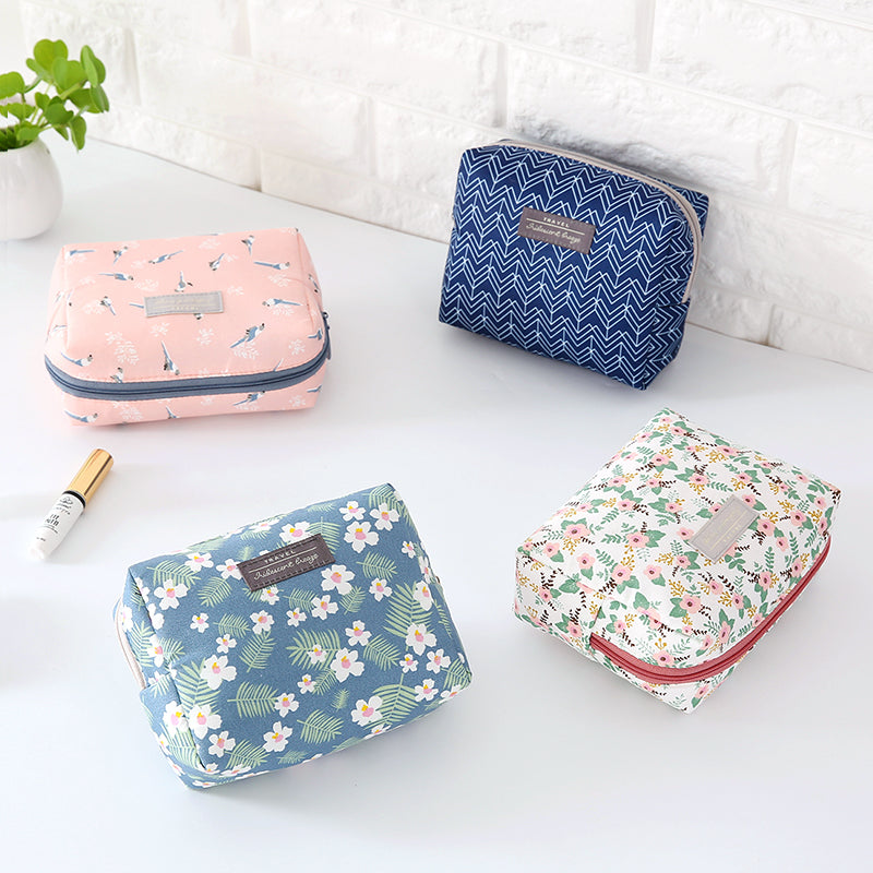 Travel Cosmetic Bag Portable Cosmetic Storage Bag featuring floral and striped designs by The Daily Drop.