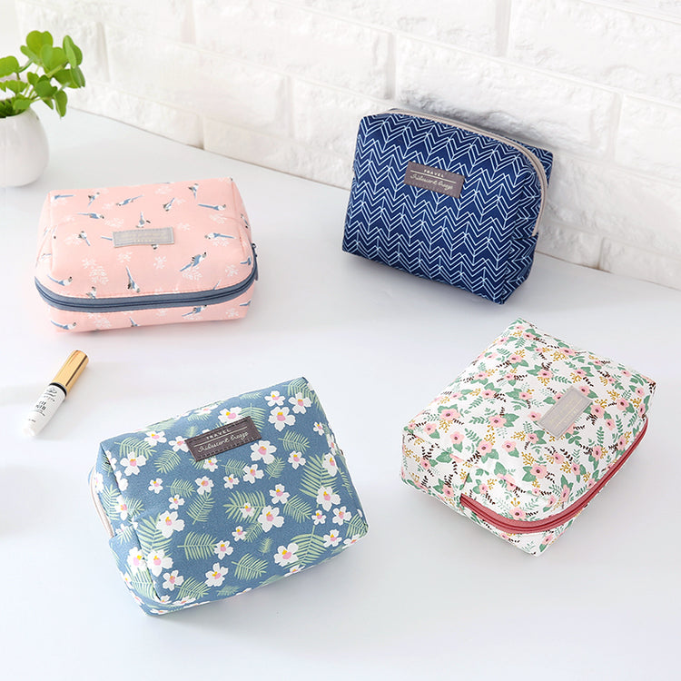 Travel Cosmetic Bag Portable Cosmetic Storage Bag featuring floral and striped designs by The Daily Drop.